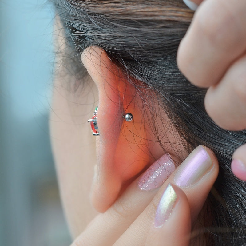 Red Apple Helix Cartilage Piercing